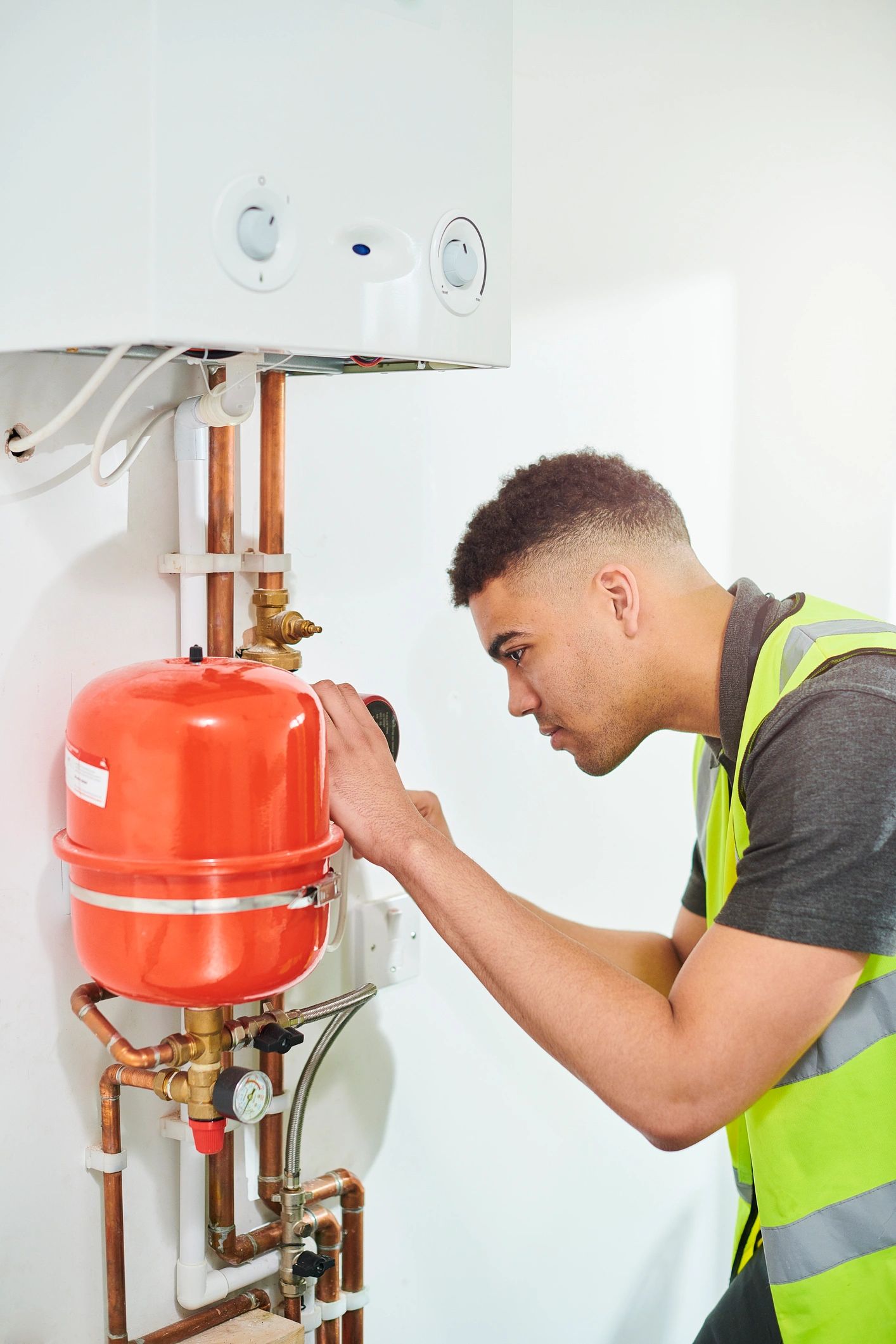Technician checking a water heater installation