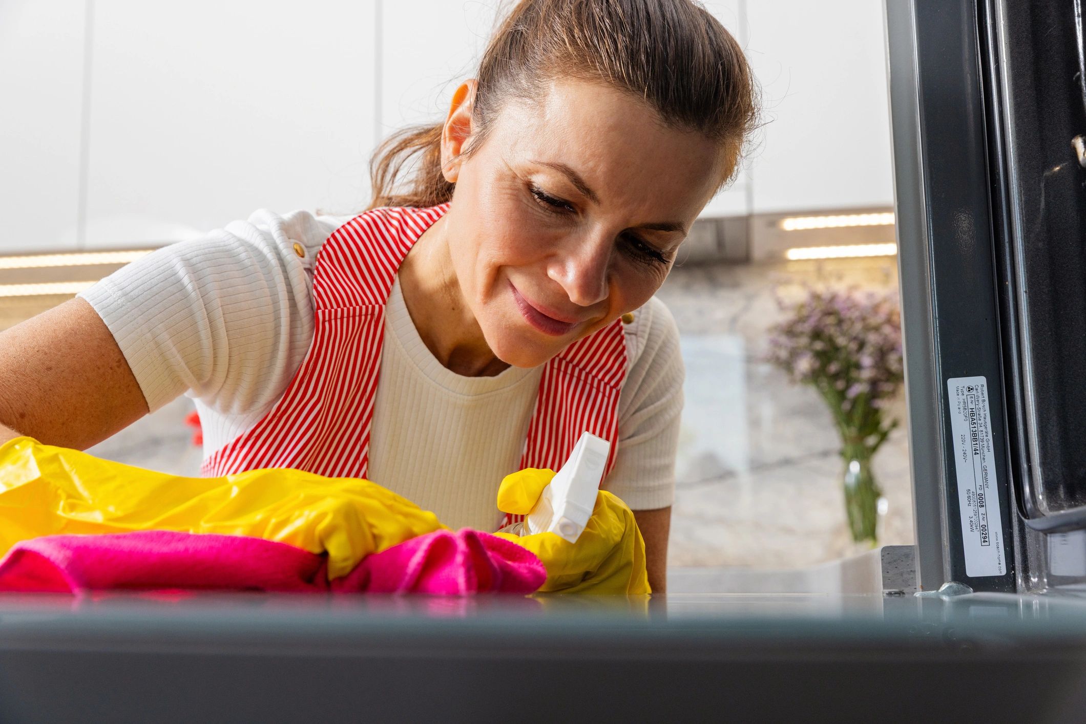 Smiling person cleaning at home