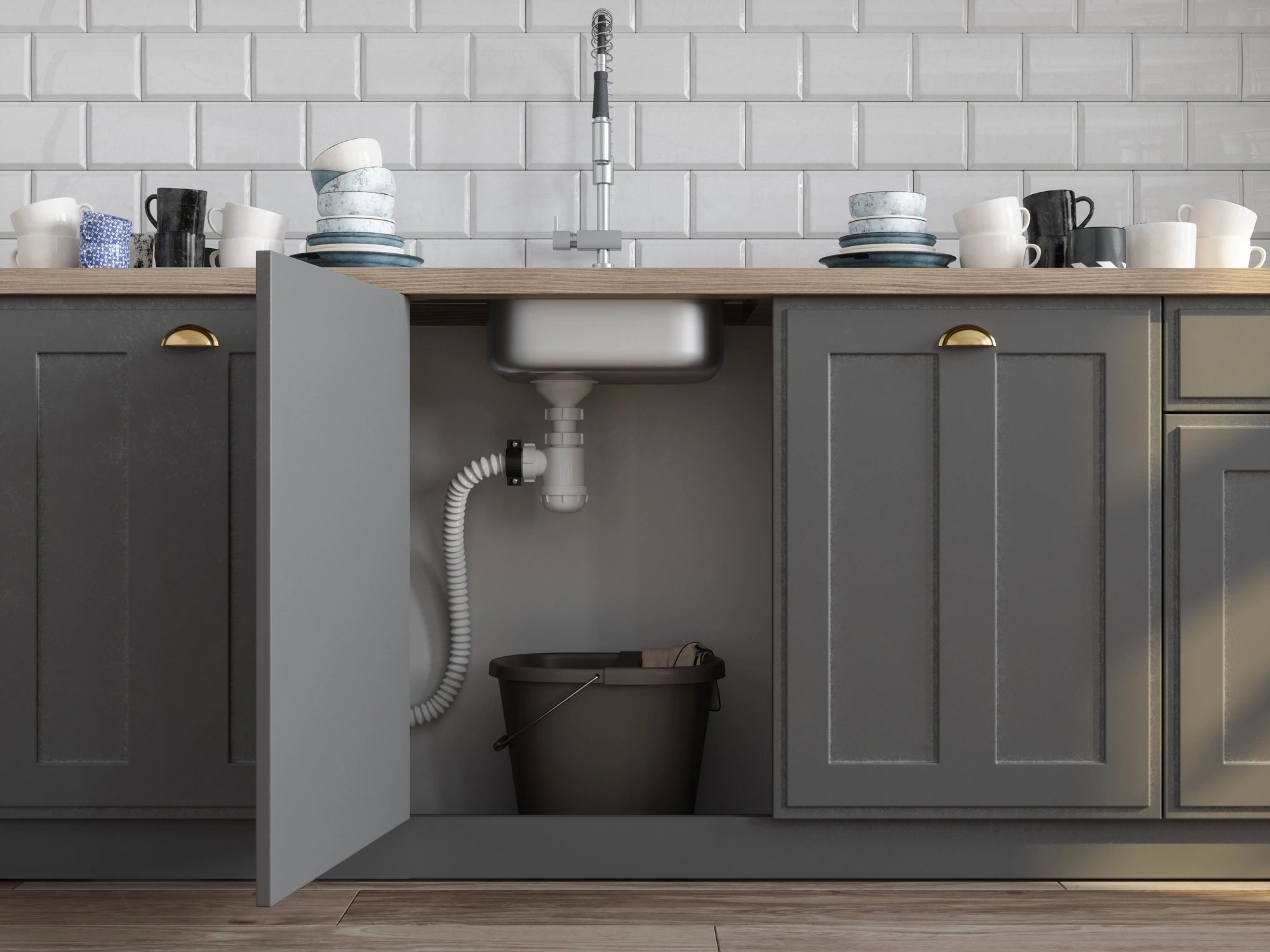 Kitchen sink cabinet with plumbing pipes