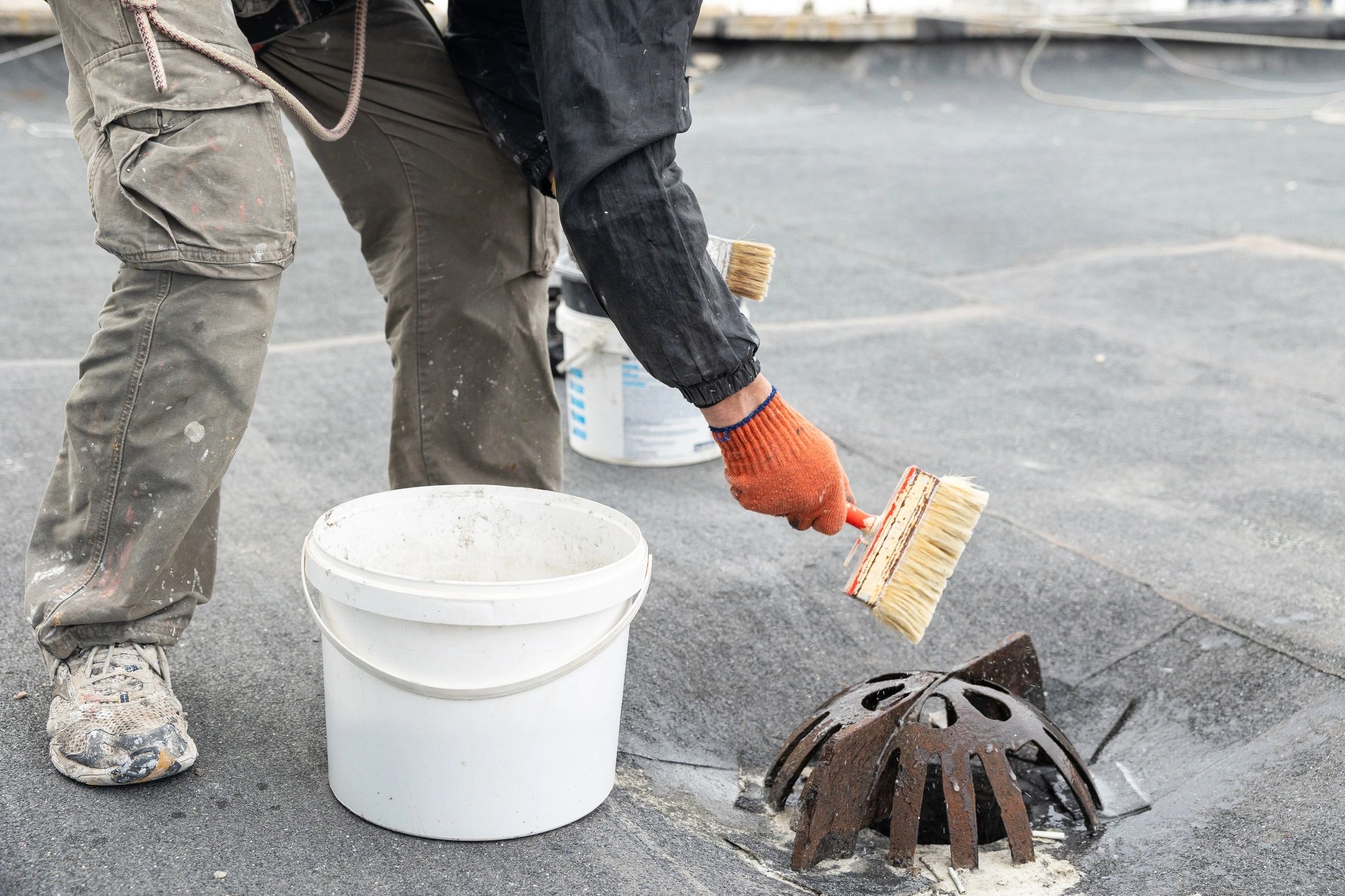 Roof drain area being cleaned and prepared